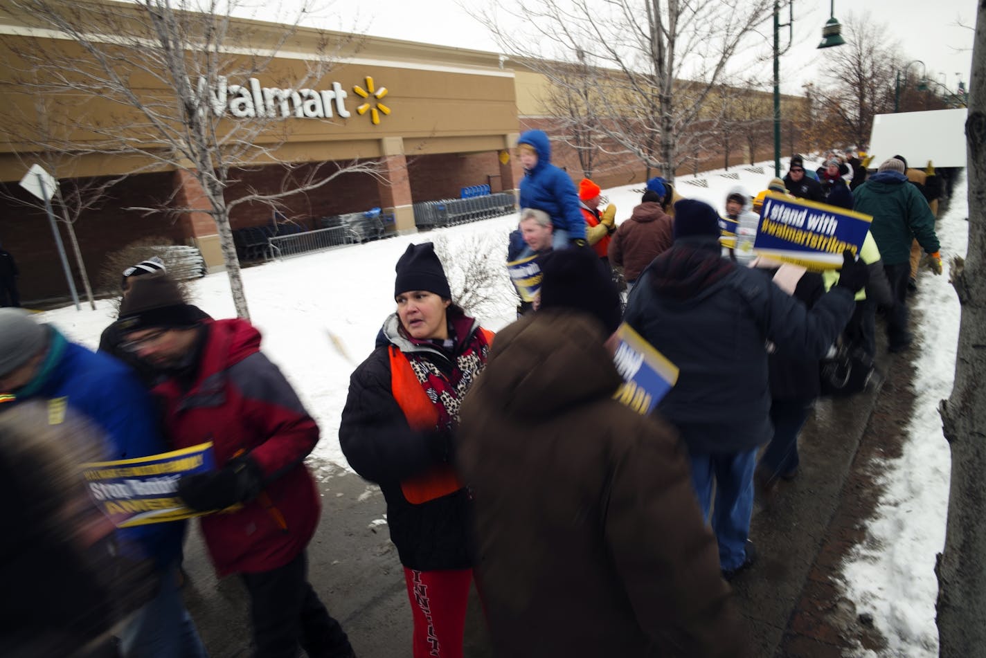 At the Walmart near the intersection of Snelling and University in St. Paul, protesters demanded living wages and better working conditions from the giant retailer.