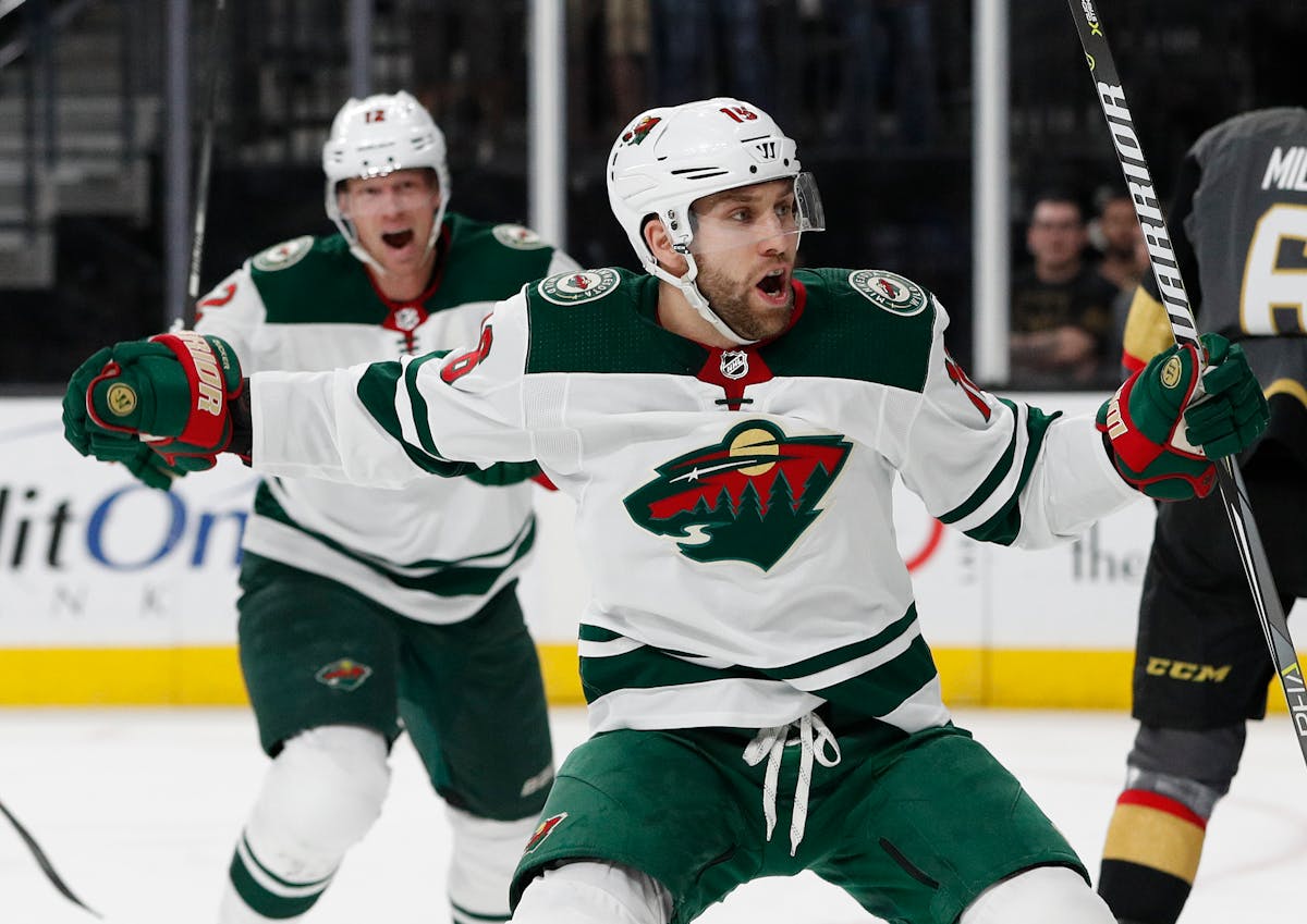 Minnesota Wild left wing Jason Zucker (16) celebrates after scoring against the Vegas Golden Knights during the first period of an NHL hockey game, Fr