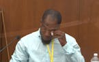In this image from video, witness Donald Williams wipes his eyes as he answers questions, as Hennepin County Judge Peter&nbsp;Cahill presides Tuesday,