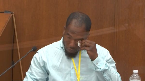 In this image from video, witness Donald Williams wipes his eyes as he answers questions, as Hennepin County Judge Peter&nbsp;Cahill presides Tuesday,