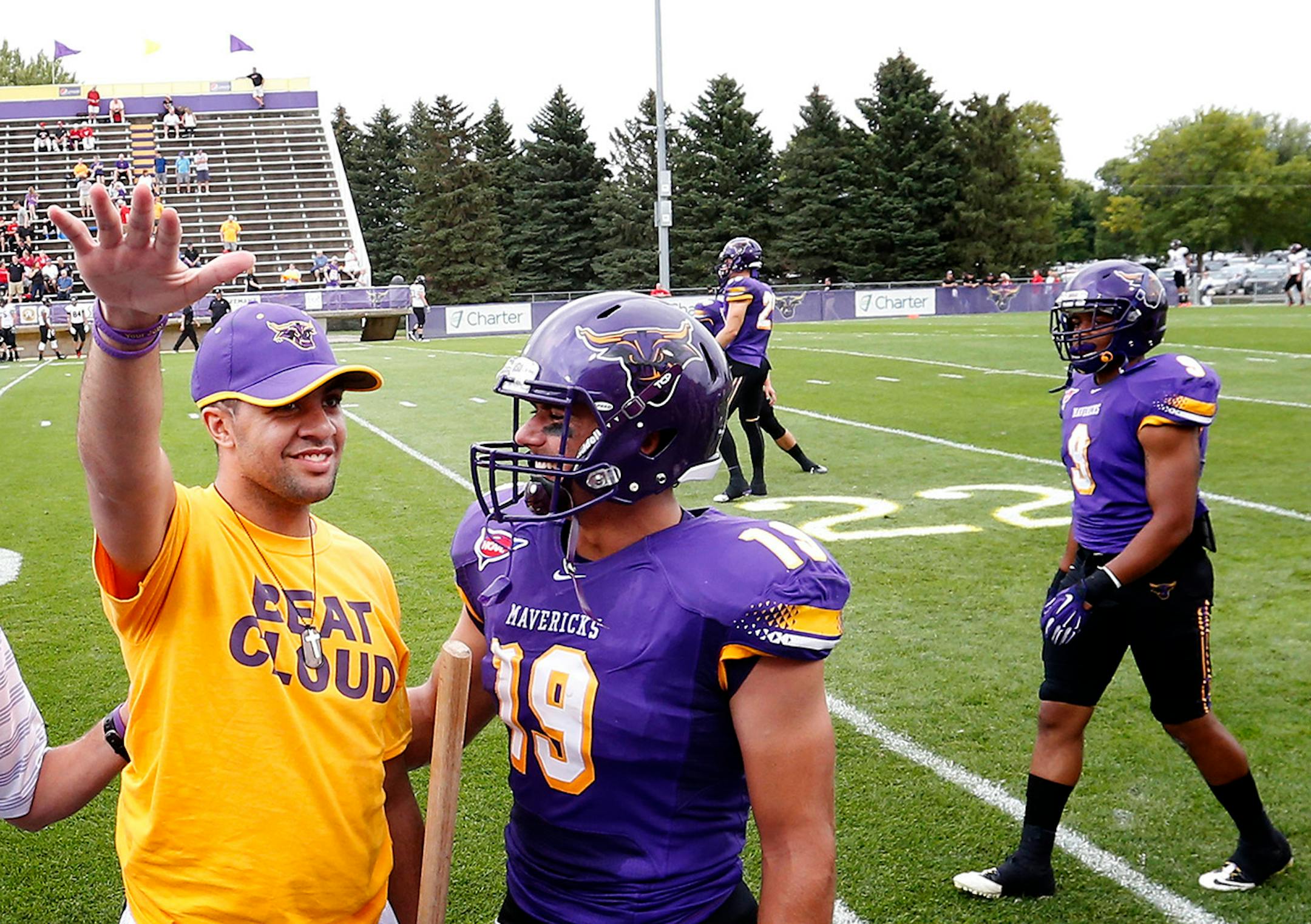 Isaac Kolstad waved to the crowd at Blakeslee Stadium before Thursday night's game vs. St. Cloud State. ] CARLOS GONZALEZ cgonzalez@startribune.com - September 4, 2014, Mankato, Minn., Minnesota State, Mankato, Blakeslee Stadium, Former Minnesota State, Mankato football player Isaac Kolstad, who was seriously injured in an assault in downtown Mankato in May, returns as honorary team captain for the Mavericks' season opener against St. Cloud State