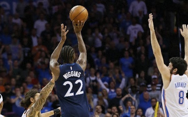 Timberwolves guard Andrew Wiggins hit the game-winning shot over the Thunder's Steven Adams as the buzzer sounded Sunday night.