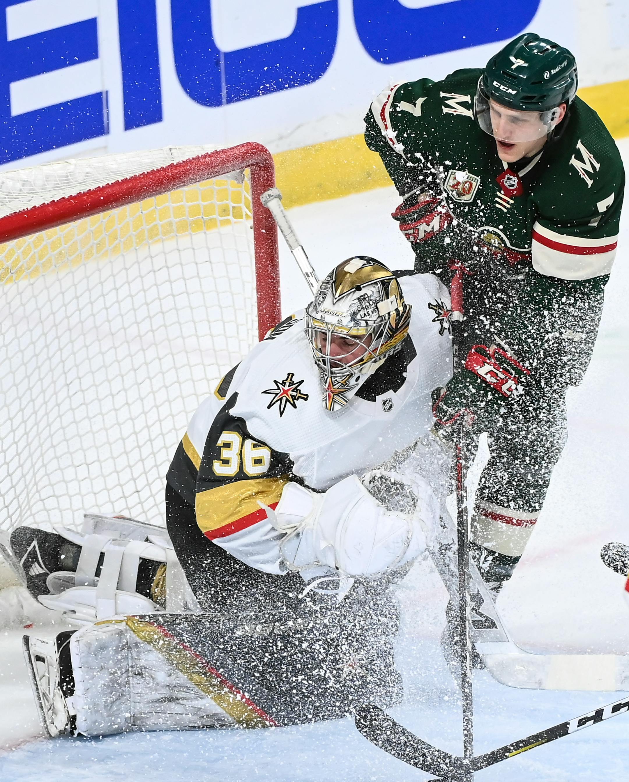 Minnesota Wild center Nico Sturm (7) and Vegas Golden Knights goaltender Logan Thompson collided in the third period.