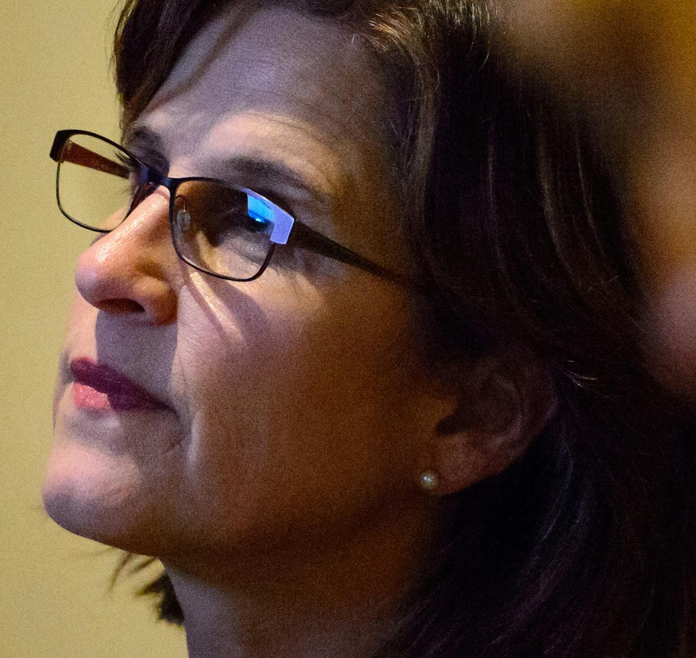 State Auditor Rebecca Otto watched the House proceedings in the hallway outside the chambers as her office was impacted by a surprise piece of legislation on the final day of the session.