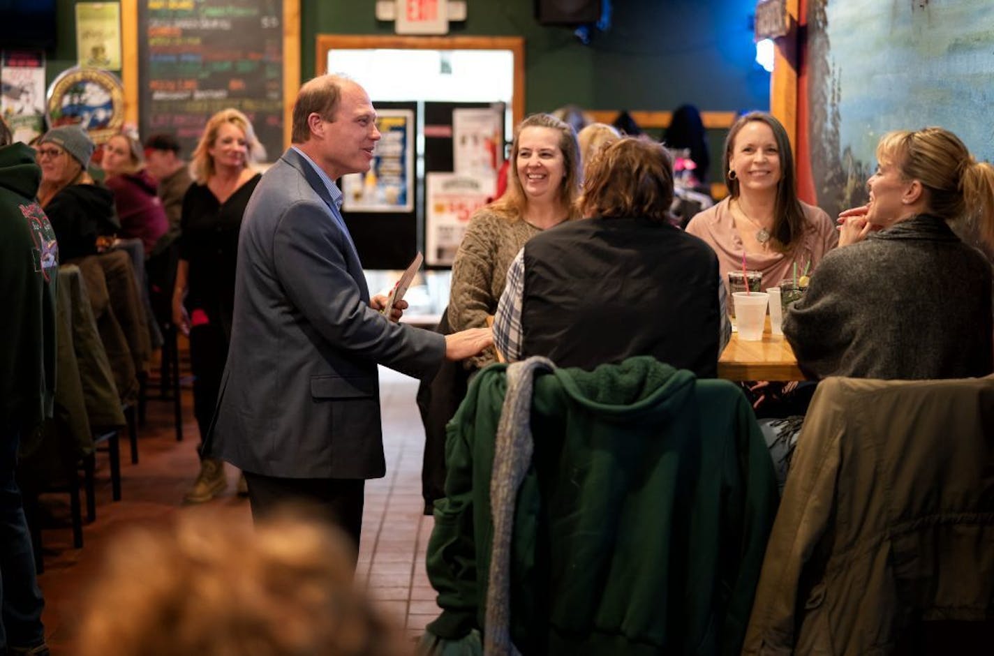 Jason Rarick, Republican candidate for State Senate in the SD11 special election, spoke with people at a Bingo fundraiser for WINDOW Victim Services, held at Doc's Bar in Sturgeon Lake.