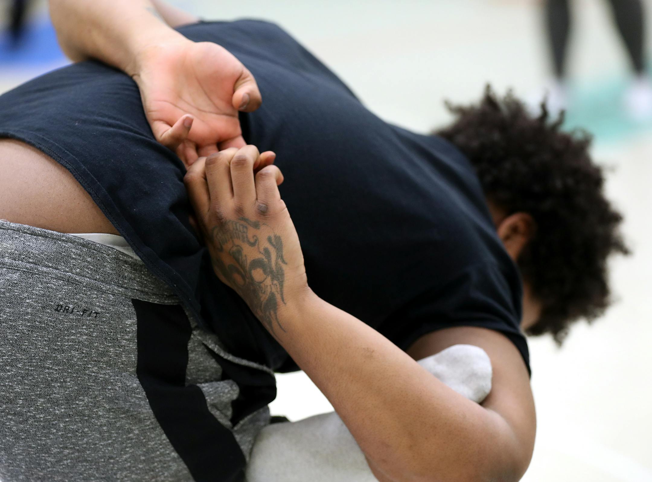 One of the boys does an advanced balancing pose during yoga class. ] LEILA NAVIDI ï leila.navidi@startribune.com BACKGROUND INFORMATION: Yoga instructor Kelly La Frenier teaches a class to a group of boys through The Link in Brooklyn Park on Tuesday, February 13, 2018. A Minneapolis yoga studio is bringing weekly yoga classes to boys who are on probation in Hennepin County, teaching the 13- to 18-year-olds mindfulness techniques. The boys, who have higher criminal level offenses, attend rep