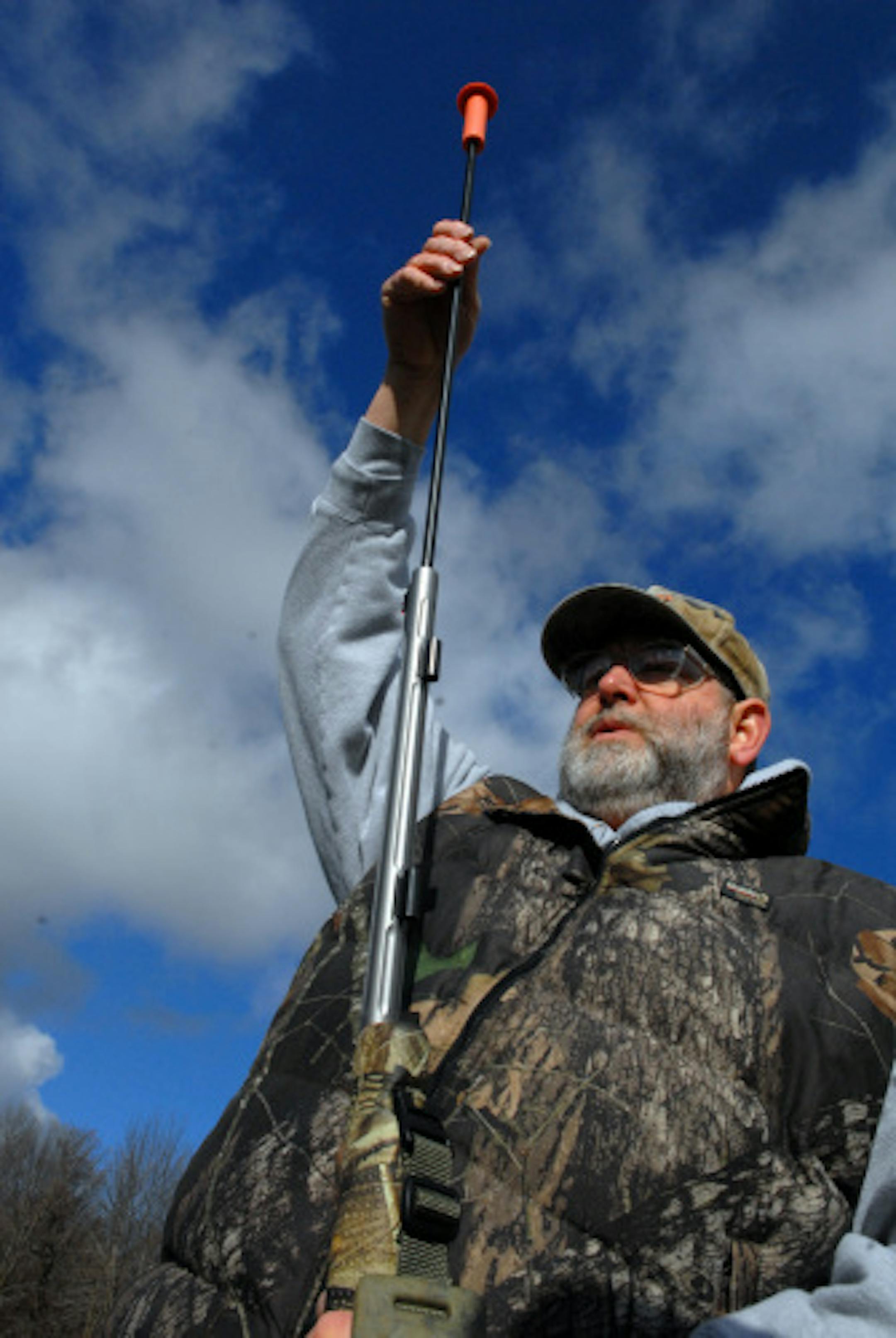 A ramrod is used to push a sabot-style bullet into the barrel of a muzzleloader. The bullet is tapped down by hunting education instructor Brett Bader of Hudson, Wis., onto two pressed pellets of Triple-Seven, a clean-burning substitute for black powder.