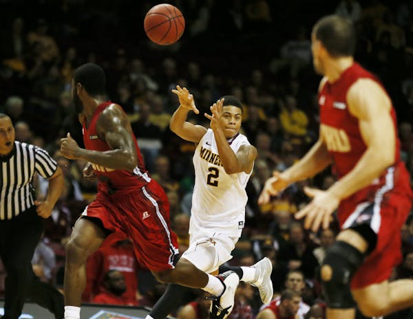 Minnesota Golden Gophers guard Nate Mason (2) passed the ball down court Tuesday at Williams Arena
