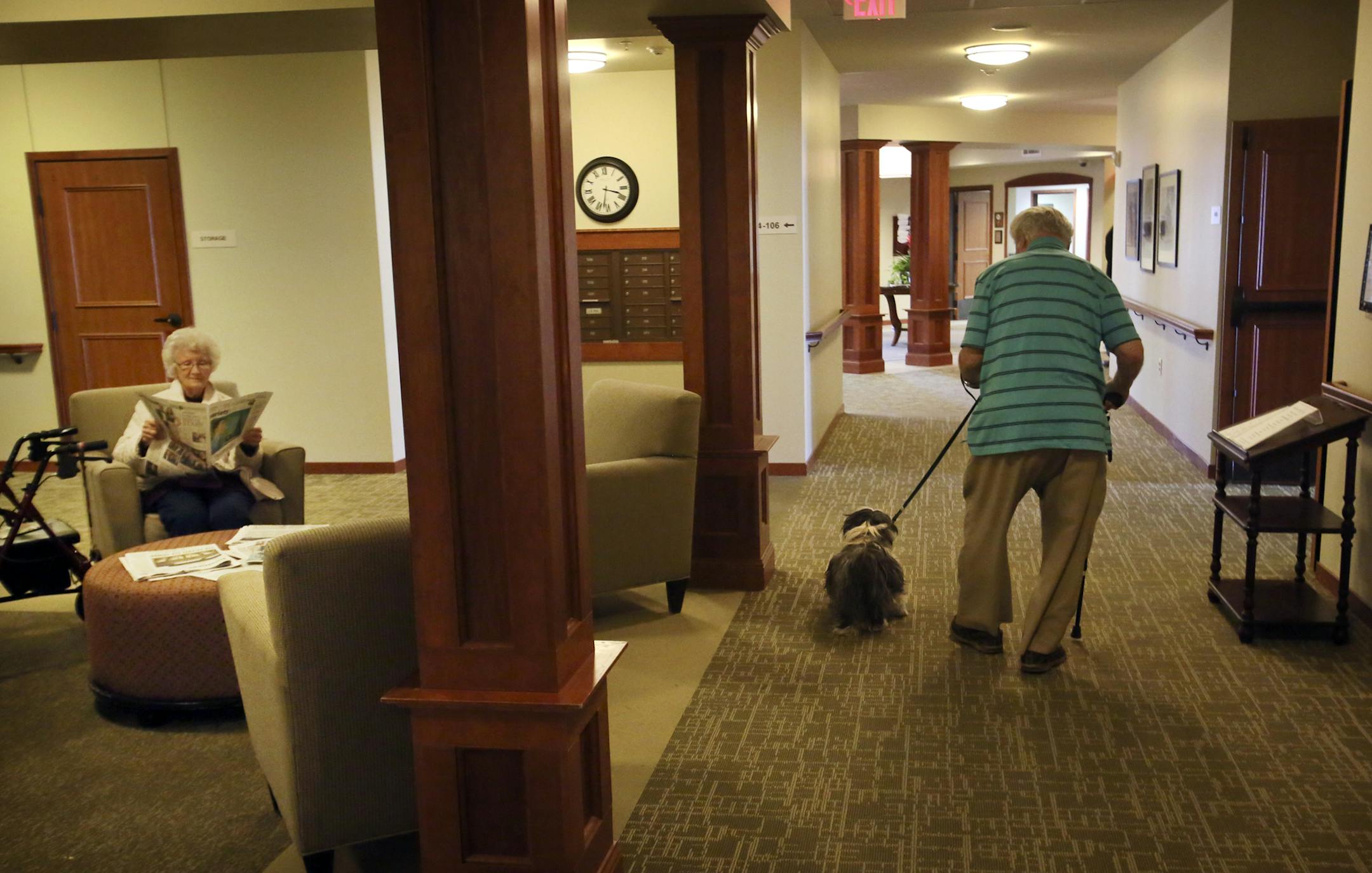 Resident Bill Bartlett walks the hall with his shih tzu Charlie while fellow resident Joan Heckler reads the newspaper at Minnehaha Senior Living Tuesday, April 8, 2014, in Minneapolis, MN.](DAVID JOLES/STARTRIBUNE) djoles@startribune.com Minneapolis is striving to build at least one new senior housing complex per ward by 2025, as part of its efforts to retain and grow the city's population. Experts say that the city is currently unprepared to handle aging seniors, who have more options in the s