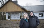 Carol and Tom Insley are building Granite House, a residence for young people living with severe and permanent brain injuries. The posed for a photo a