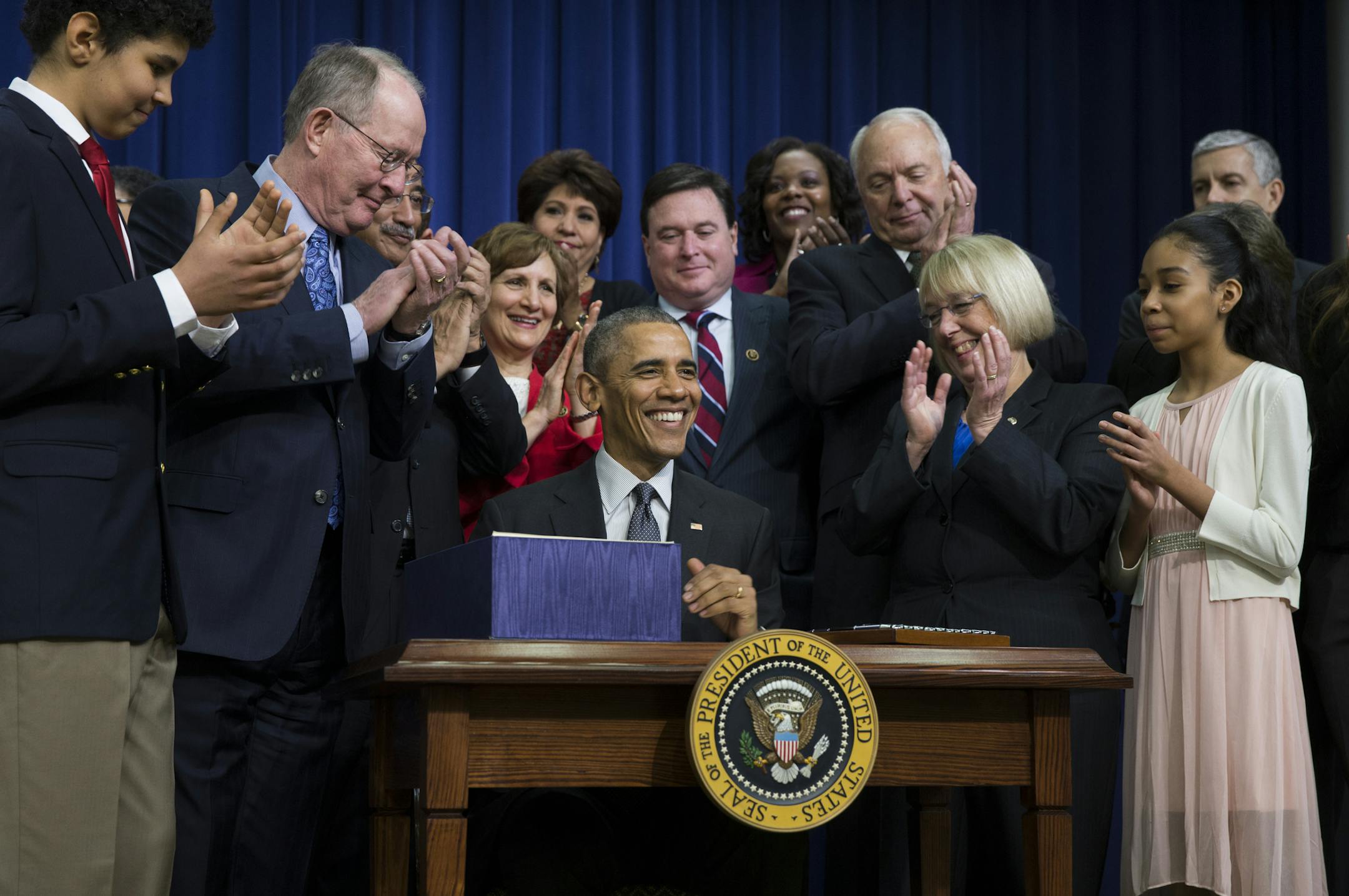 President Barack Obama speaks before signing the "Every Student Succeeds Act," a major education law setting U.S. public schools on a new course of accountability, Thursday, Dec. 10, 2015, in Washington. The law will change the way teachers are evaluated and how the poorest performing schools are pushed to improve. (AP Photo/Evan Vucci)