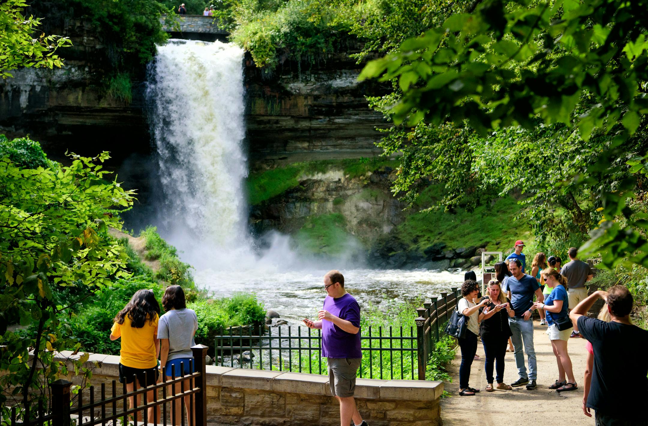 Visitors to Minnehaha Falls checked their selfies before leaving. ] GLEN STUBBE * gstubbe@startribune.com Friday, September 2, 2016 This year has shaped up to be the eighth wettest summer on record in the Twin Cities, prompting no-wake rules and high water warnings at metro lakes and rivers as boaters head out this Labor Day weekend for the final big boating weekend of the year. On Wednesday, the Minnehaha Creek Watershed District recommended no paddling on the creek because it's flowing too qui