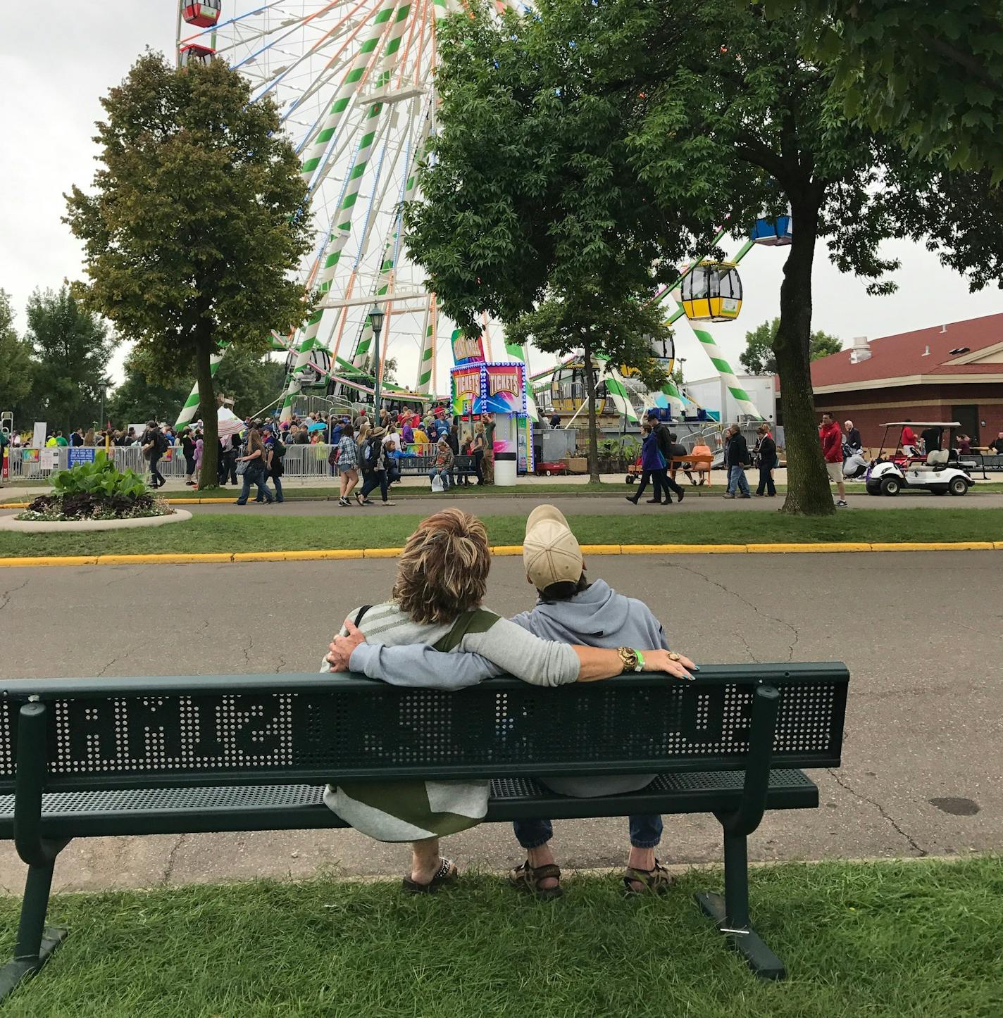 Ed Mosiman and his sister, Sue, sit on the bench that wife Wendy bought for him.