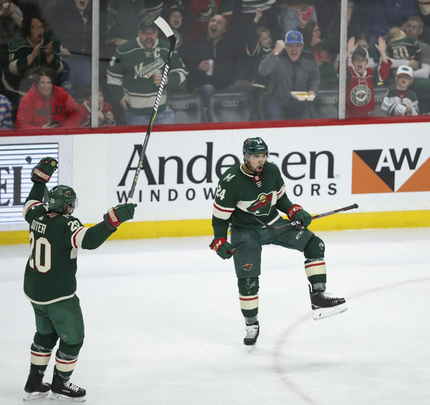 Minnesota Wild defenseman Matt Dumba (24) celebrated his second period goal with teammate Ryan Suter (20).