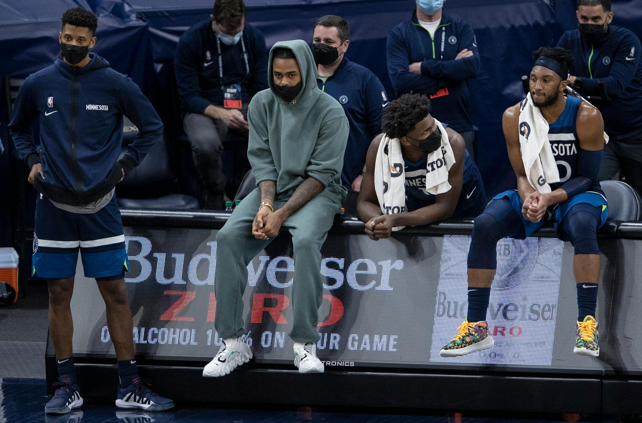 Jarrett Culver, D'Angelo Russell, Anthony Edwards and Josh Okogie watched from the Minnesota Timberwolves bench in the final minute of the game.