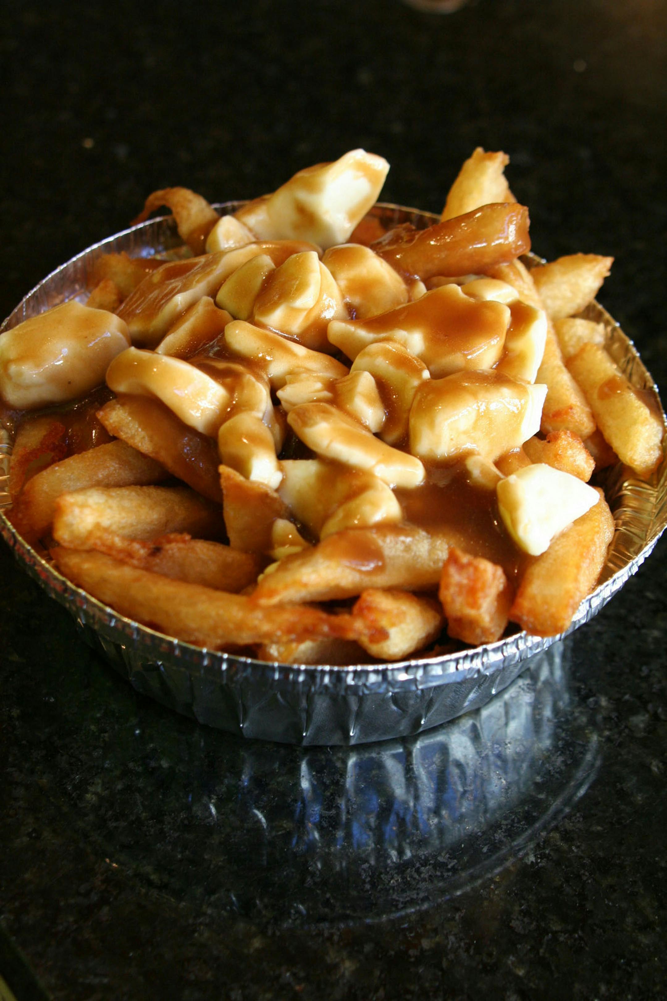 Many people in Quebec adore poutine, a regional dish featuring fries topped with cheese curds and brown gravy.