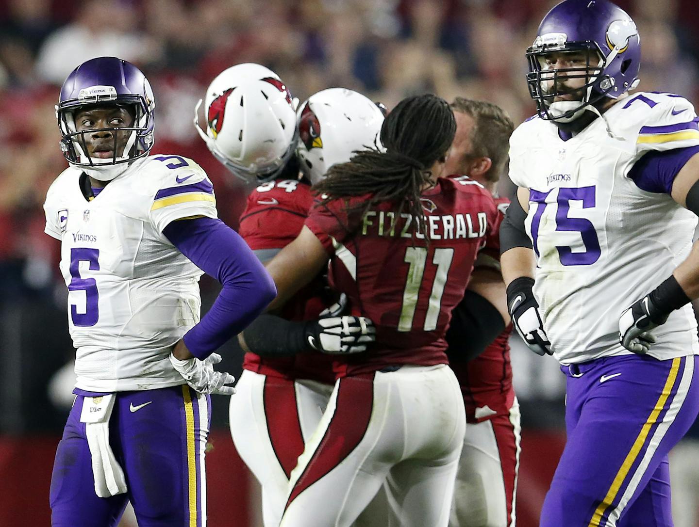 Vikings quarterback Teddy Bridgewater (5) and Matt Kalil (75) walked off the field as the Cardinals celebrated after recovering a Bridgewater fumble in the final seconds of the game. ] CARLOS GONZALEZ &#x2022; cgonzalez@startribune.com - December 10, 2015, Glendale, AZ, University of Phoenix Stadium, NFL, Minnesota Vikings vs. Arizona Cardinals