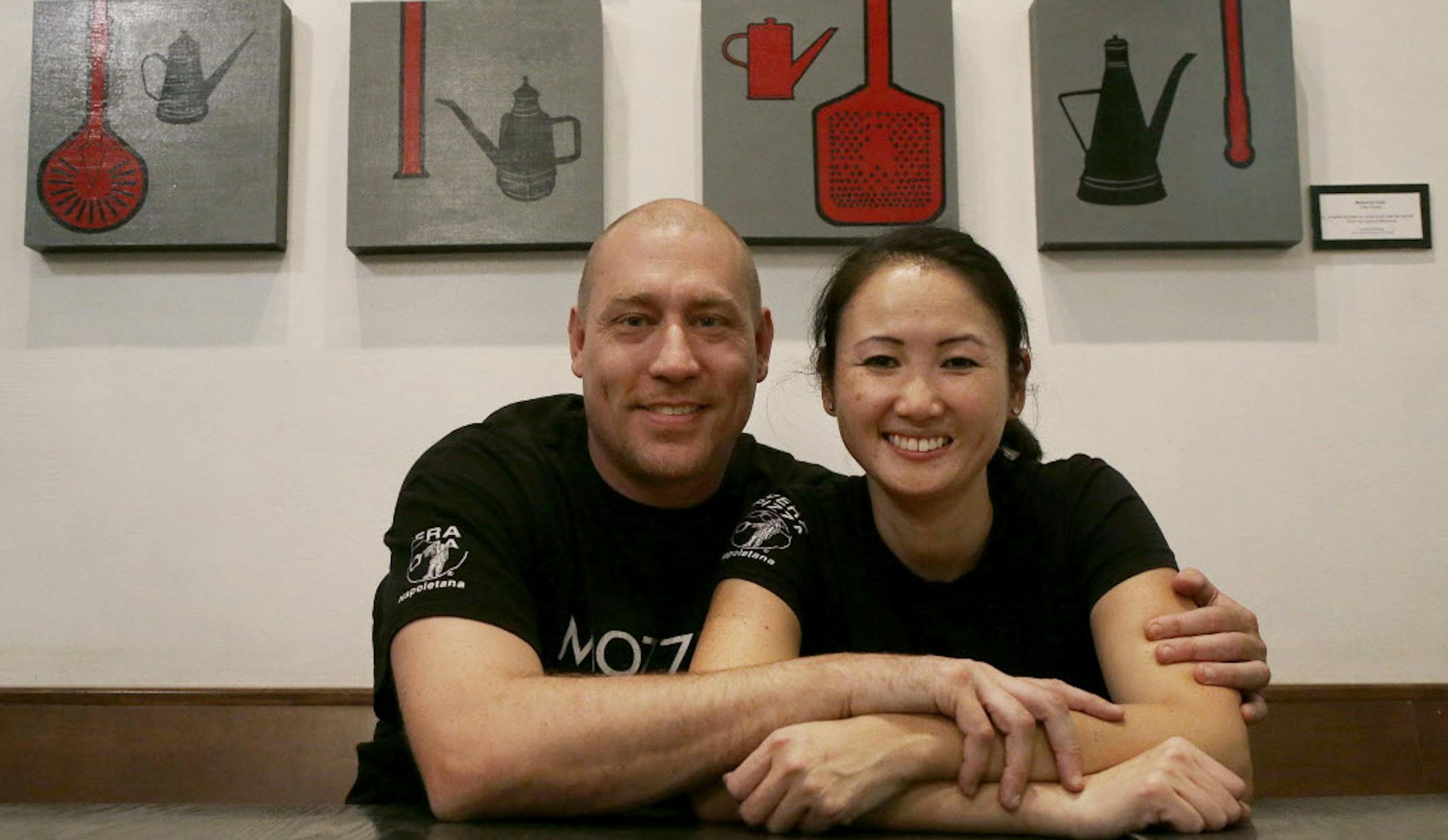 In this Nov. 5, 2015 photo, Mozzeria owners Russ and Melody Stein pose for a photo at their restaurant in San Francisco. The Steins and Mozzeria staff workers are deaf. The Steins have run their restaurant since 2011. (AP Photo/Jeff Chiu)
