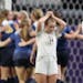 Mahtomedi players celebrated there 2-1 win as Orono's Holly Tesar left and Megan Marzolf walked of the field during 1A girls' championship at U.S. Ban