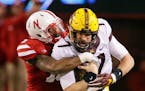 Mitch Leidner is tackled by Nebraska linebacker Michael Rose-Ivey during the second half last season. Plans are in the works for the Gophers and Cornh