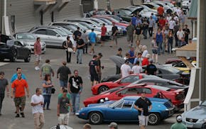 Thousands of people attended the open house, showcasing cars of every make and type at the AutoMotorPlex in Chanhassen, August 6th, 2011. People are i