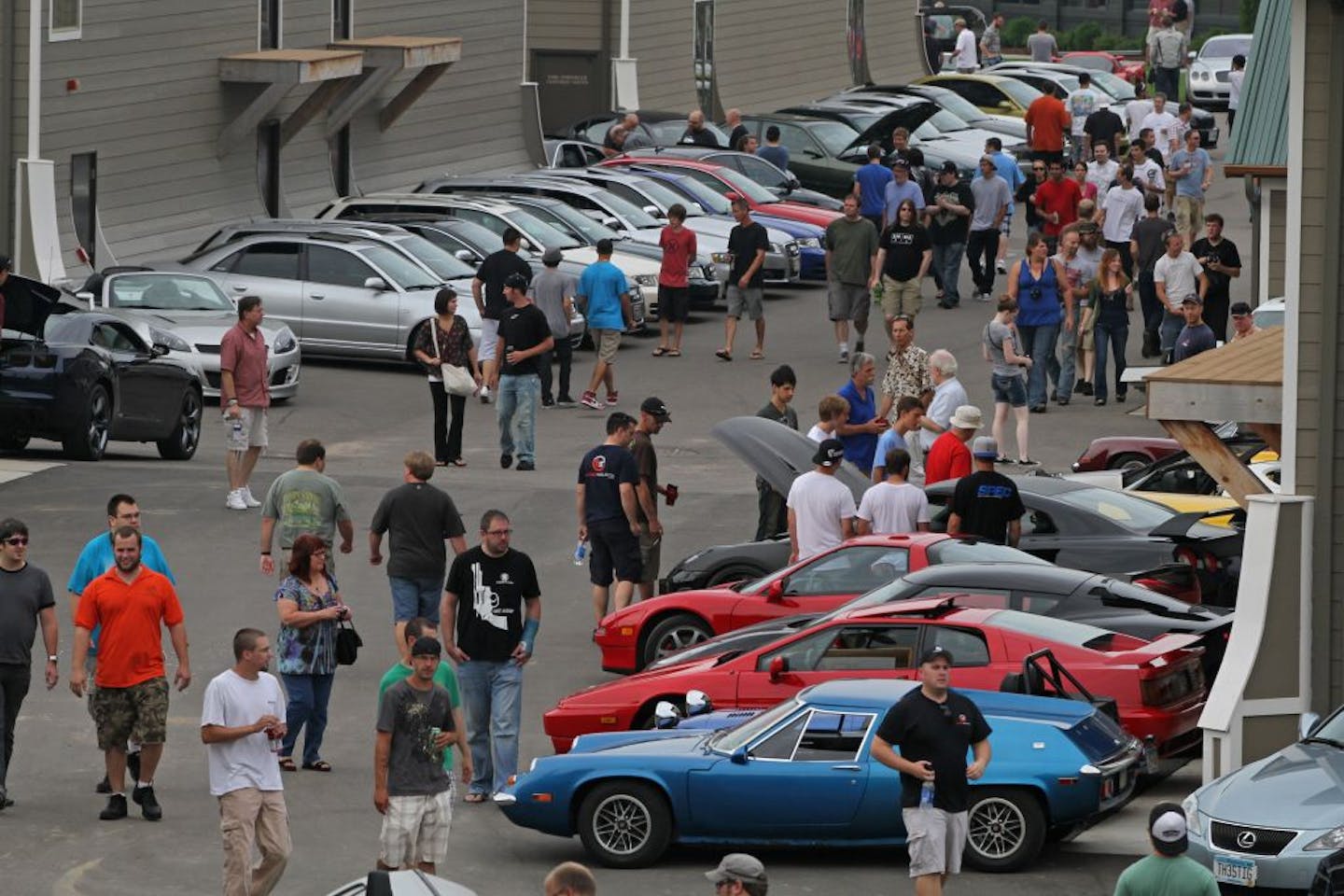 Thousands of people attended the open house, showcasing cars of every make and type at the AutoMotorPlex in Chanhassen, August 6th, 2011. People are invited to show off their prized vehicle and many garage owners join in the show, opening up their car condos to the public.