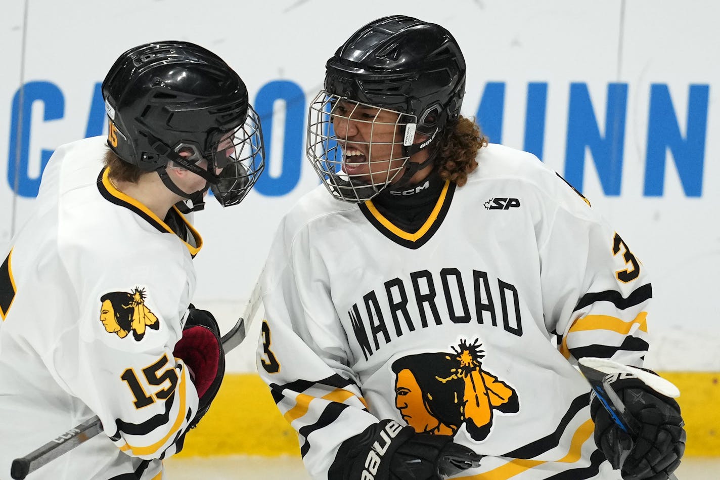 Warroad forward Peyton Sunderland (33) celebrates with fellow forward Taven James (15) after scoring in the first period of a MSHSL Class 1A state semifinal hockey game between Warroad and Orono Friday, March 10, 2023 at the Xcel Energy Center in St. Paul, Minn. ] ANTHONY SOUFFLE • anthony.souffle@startribune.com