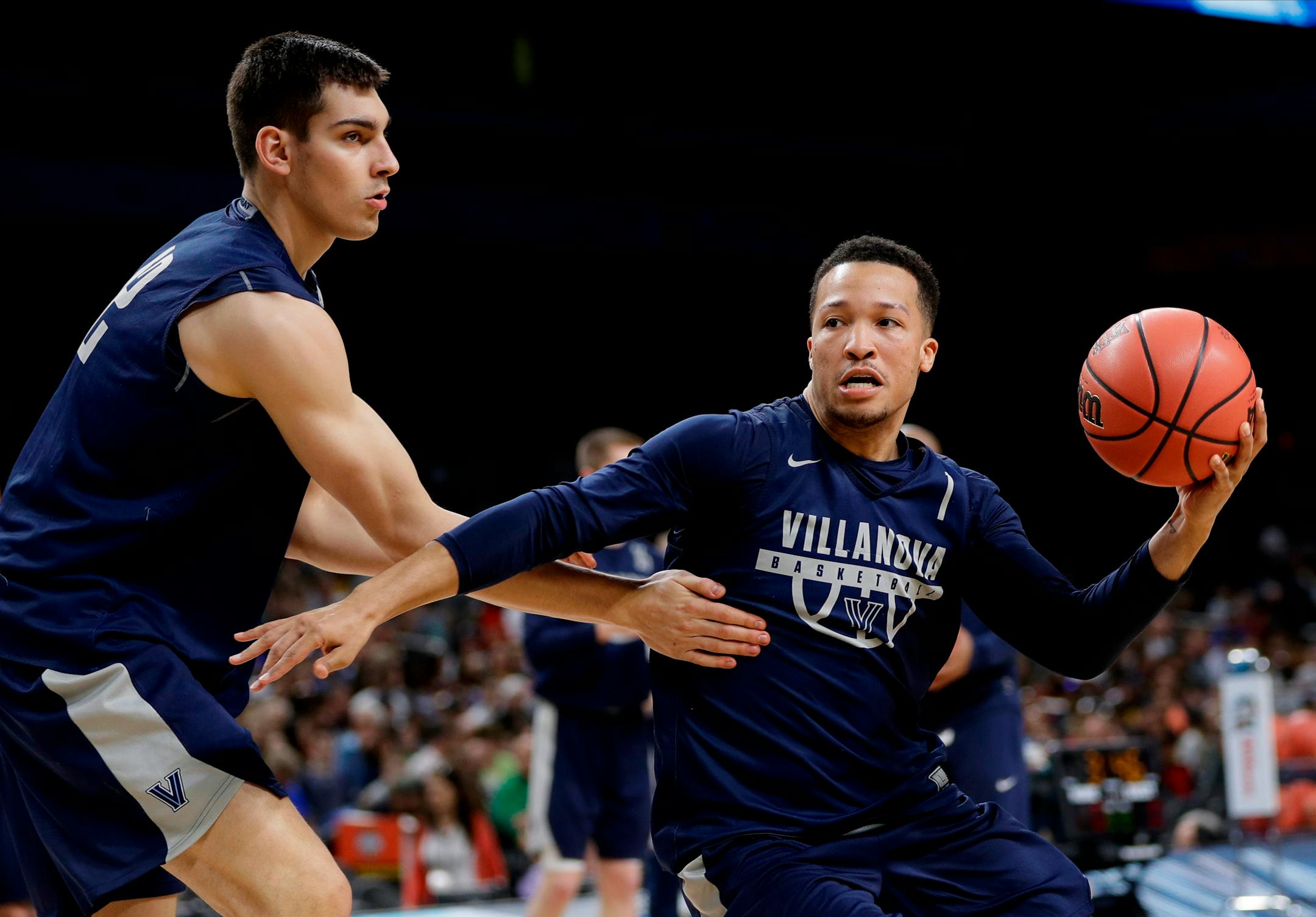 Villanova guard Jalen Brunson, right, drives past teammate Dylan Painter, left, during a practice session for the Final Four NCAA college basketball tournament, Friday, March 30, 2018, in San Antonio. (AP Photo/David J. Phillip)