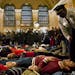 Protesters staged a "die-in" in response to a grand jury's decision not to bring charges in the death of Eric Garner, in New York's Grand Central Term