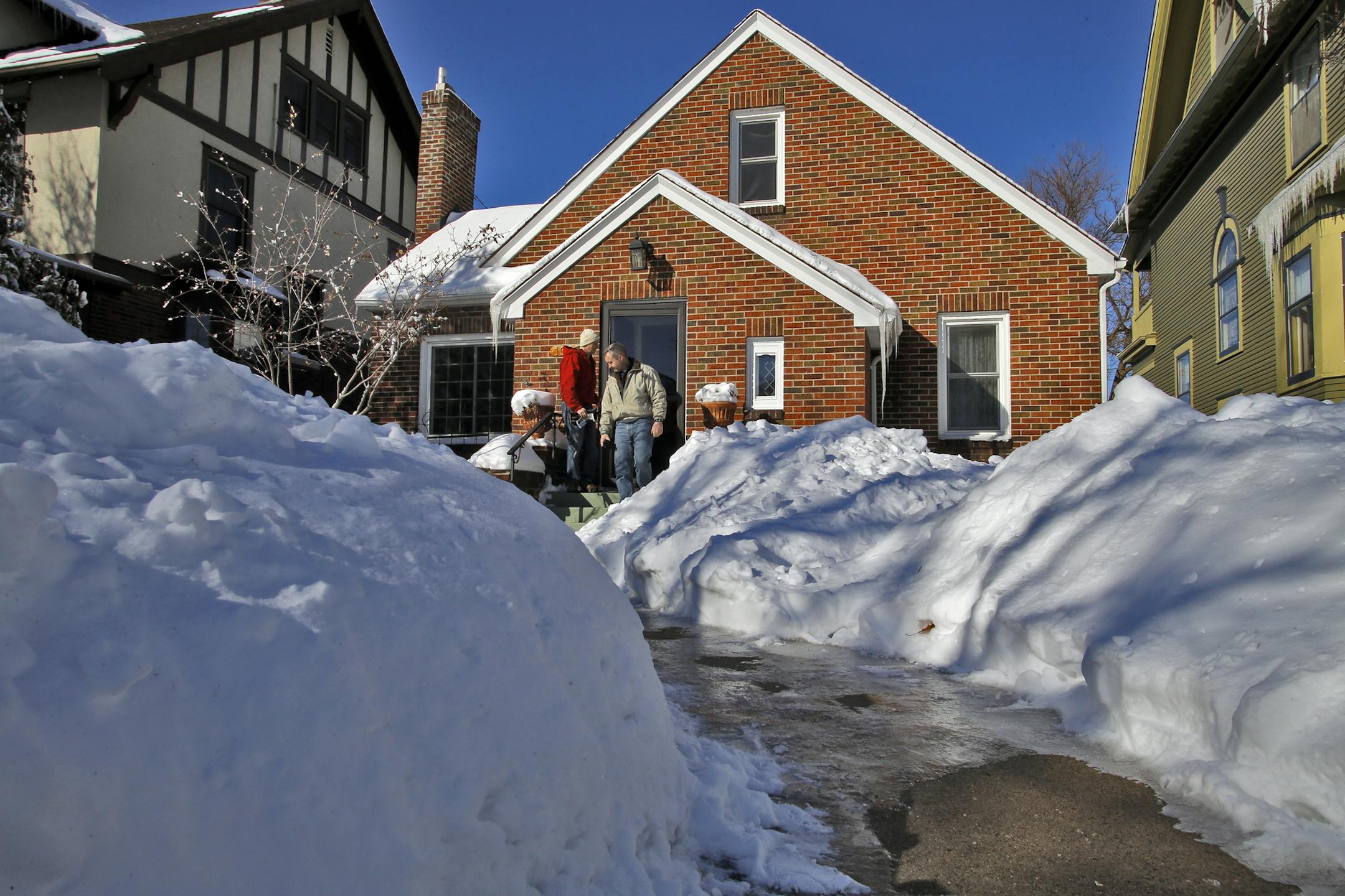 Snow was piled up around a St. Paul home that was the subject of a recent open house.