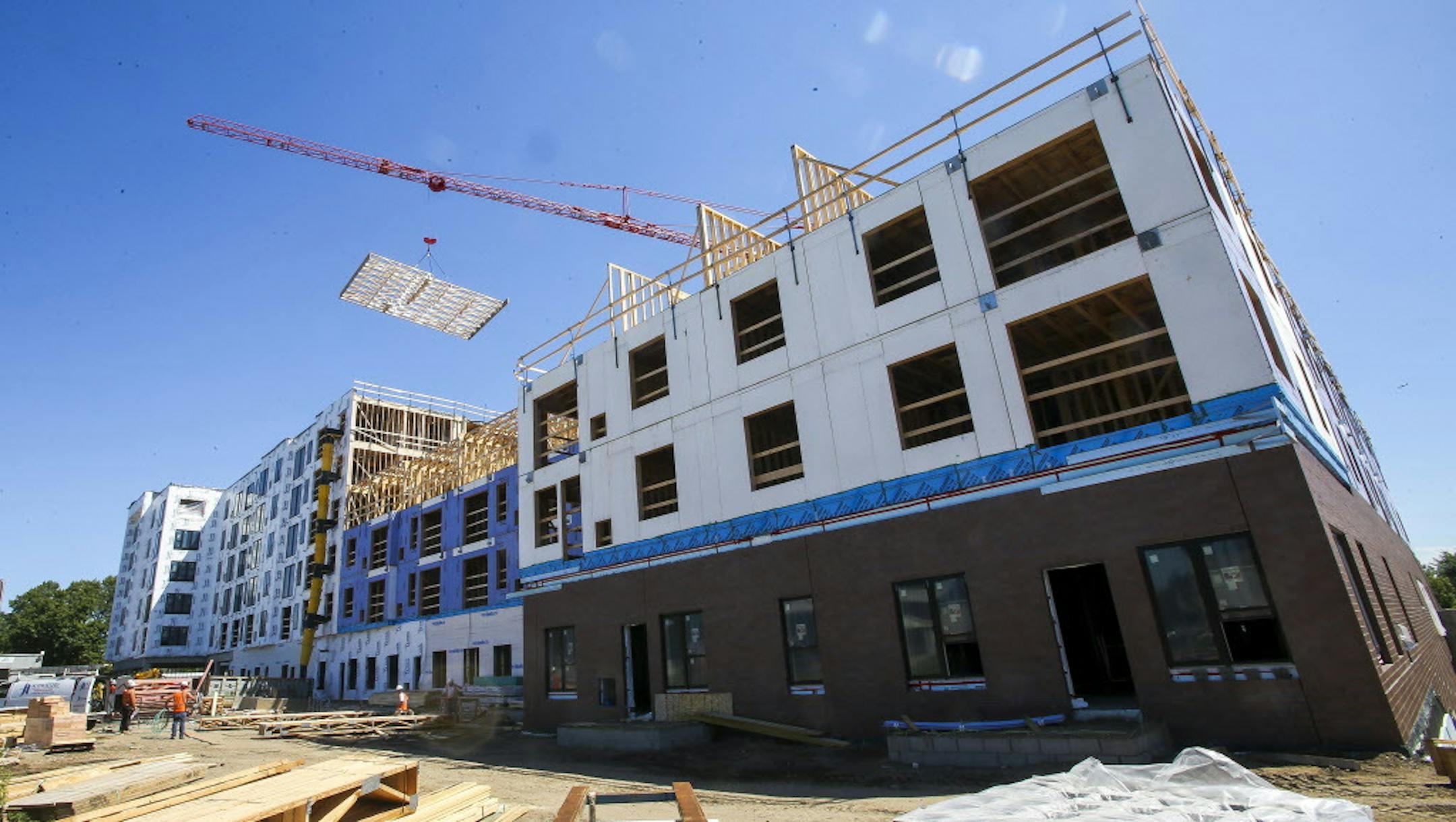 Hello Apartments is a 172-unit complex slated to be completed in December 2016. Regulators are currently exploring whether substandard wood in paneling is being used. ] Timothy Nwachukwu &#x2022; timothy.nwachukwu@startribune.com Construction work of Hello Apartments is performend on Friday, July 22, 2016. Though the apartment building is scheduled to be completed by December 2016, regulators are exploring whether substandard wood is being used.