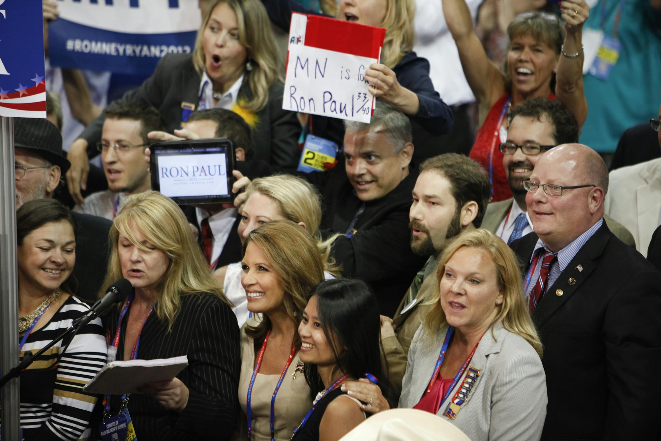 Rep. Michelle Bachmann (R-Minn.), center, with the Minnesota delegation as they announce 33 of 40 votes for Ron Paul during the Republican National Convention at the Tampa Bay Times Forum in Tampa, Fla., Aug. 28, 2012. Mitt Romney's six-year quest for the Republican presidential nomination culminated Tuesday afternoon when most of the 4,400 delegates gathered in Tampa officially made him their choice to reclaim the White House from President Barack Obama and the Democrats.