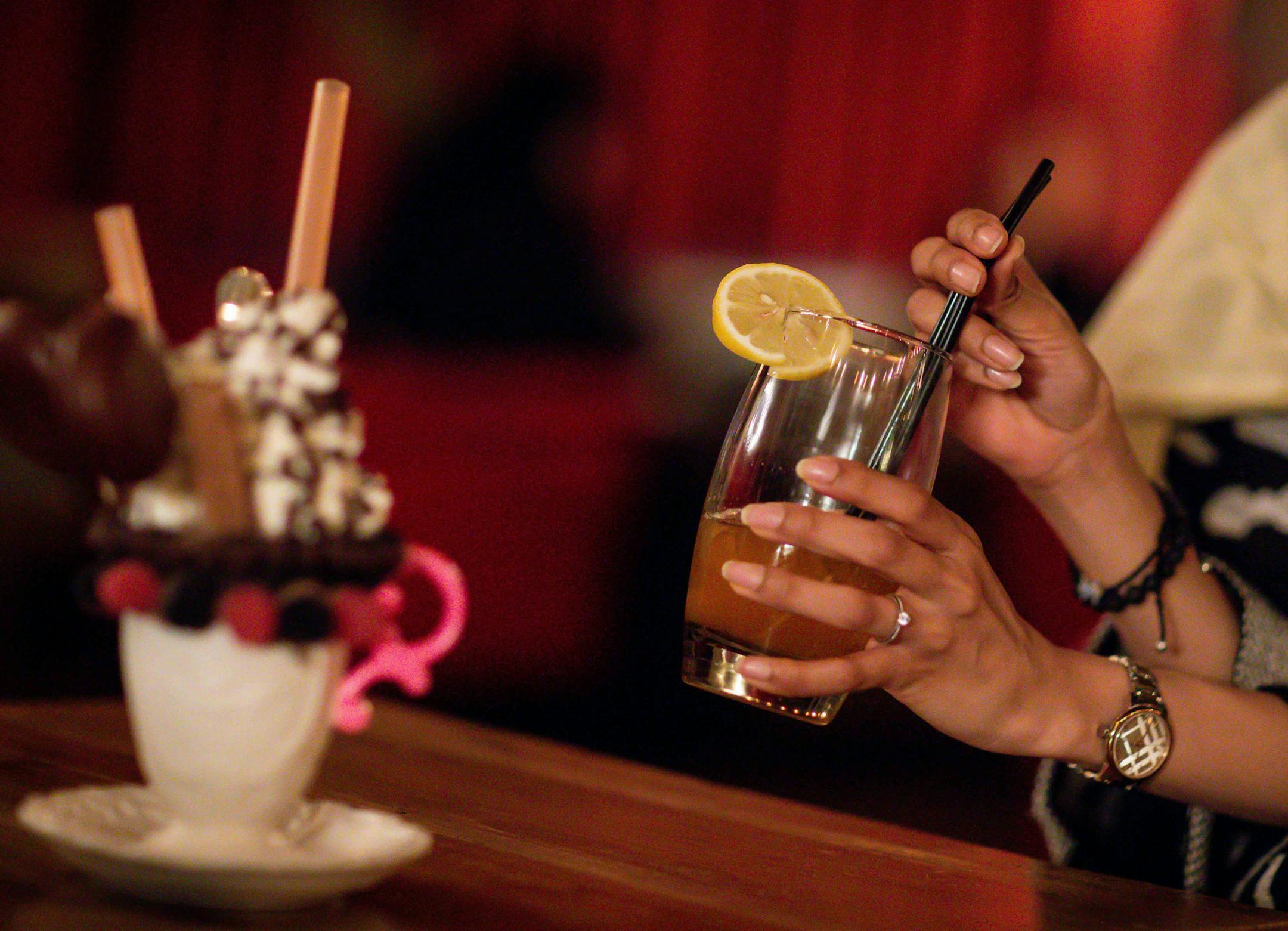 A customer drinks a non-alcoholic drink in a cafe in Riyadh. MUST CREDIT: Bloomberg photo by Tasneem Alsultan.