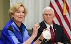 FILE - In this March 5, 2020, file photo, Dr. Deborah Birx, Ambassador and White House coronavirus response coordinator, holds a 3M N95 mask as Vice P