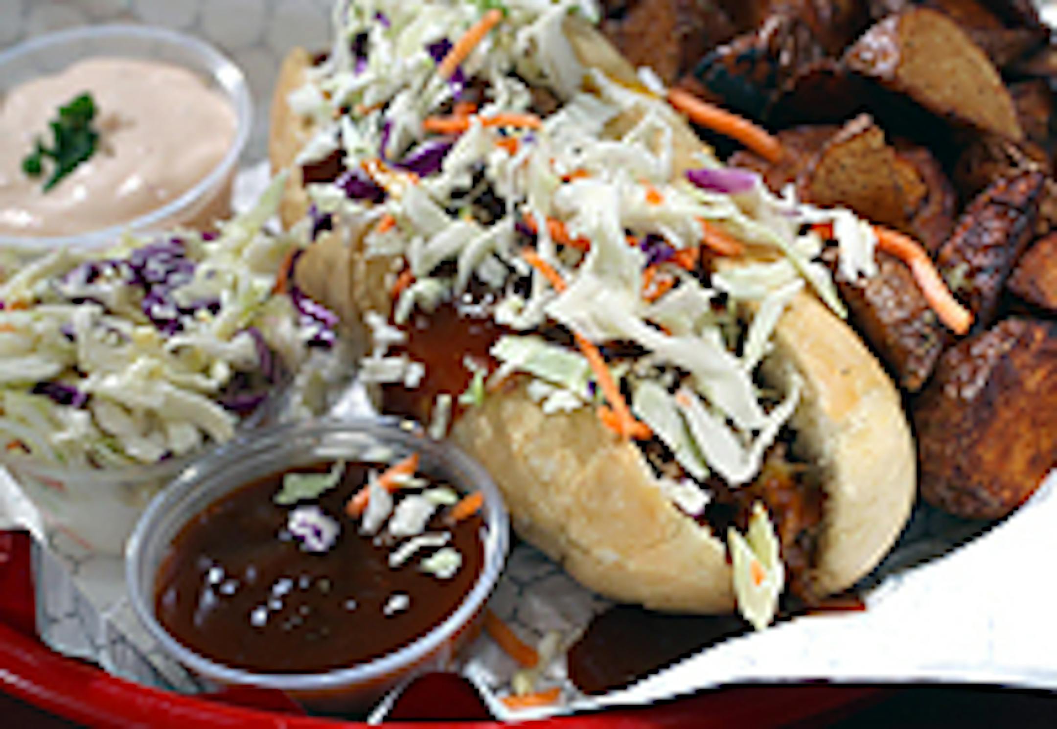 Q Fanatic's "Pulled Pork Sandwich" with spicy potatoes and Cole Slaw