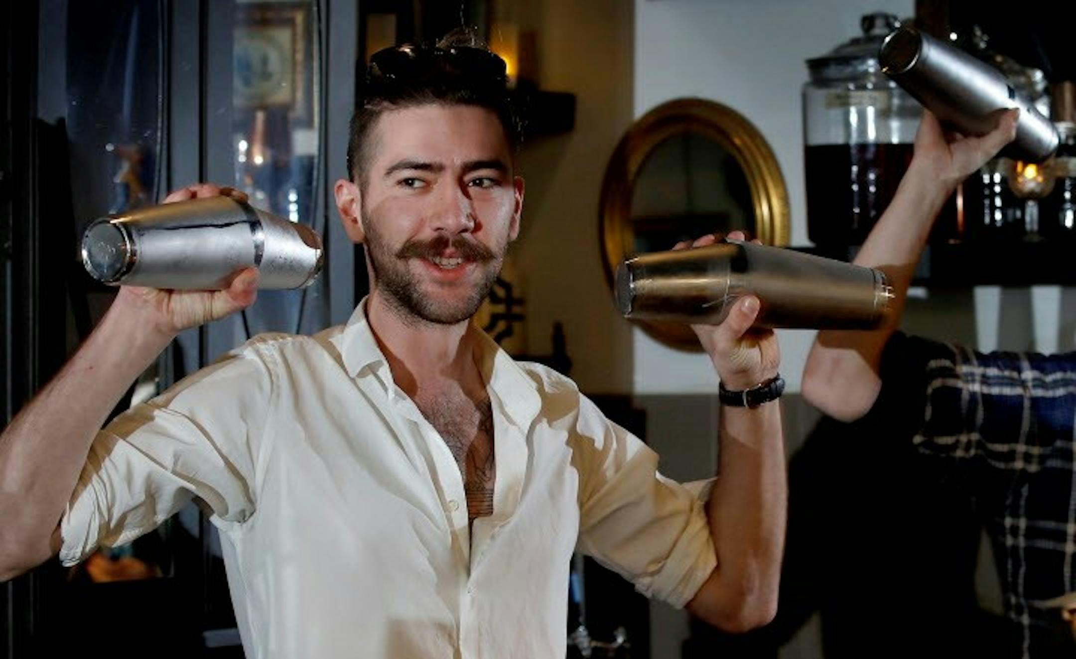 Marco Zappia mixed up a drink during a cocktail making class at Lawless Distilling Company. ] CARLOS GONZALEZ &#xef; cgonzalez@startribune.com - January 31, 2017, Minneapolis, MN, Seven years after founding a bitters company in Milwaukee, Bittercube has gained national attention for their products. Nick Kosevich and Marco Zappia are responsible for some of the hottest bar programs. Kosevich and Zappia will be leading a cocktail-making class at Lawless Distilling Company. ORG XMIT: MIN17020119231