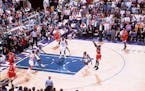 FILE -- Chicago Bulls' Michael Jordan makes the winning shot during Game 6 of the NBA Finals against the Utah Jazz at the Delta Center in Salt Lake Ci