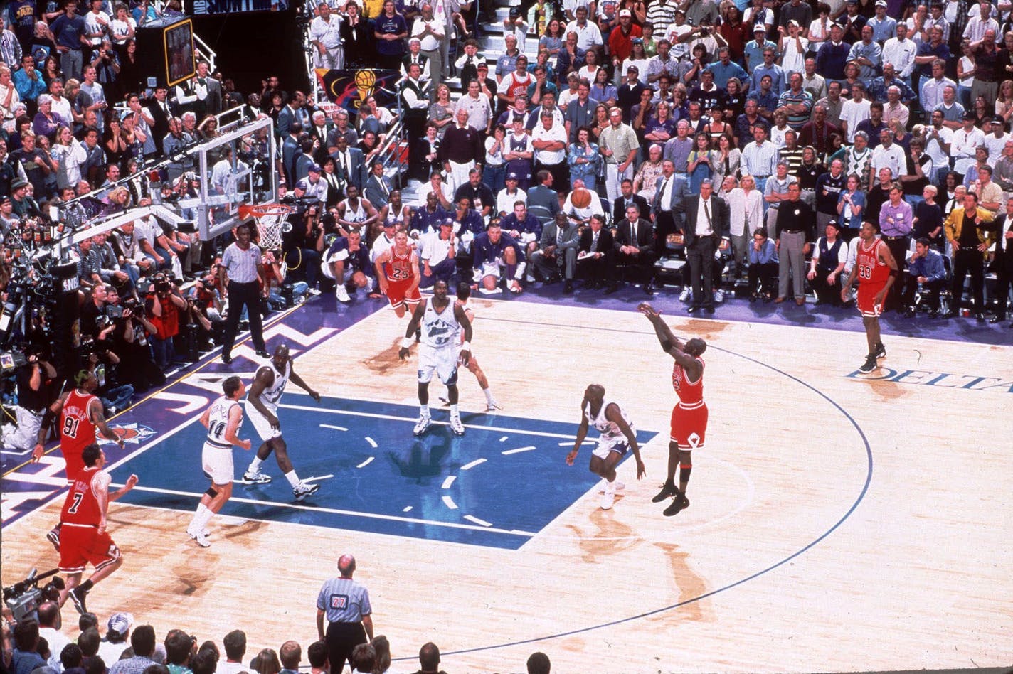 FILE -- Chicago Bulls' Michael Jordan makes the winning shot during Game 6 of the NBA Finals against the Utah Jazz at the Delta Center in Salt Lake City, Utah, in this June 14, 1998 photo. Jordan, the greatest player in NBA history and the most popular athlete since Muhammad Ali is expected to announce his retirement Wednesday, a source with close ties to the NBA told The Associated Press on Monday night Jan. 12, 1999. The Bulls scheduled a news conference for noon EST Wednesday. (AP Photo/Scott