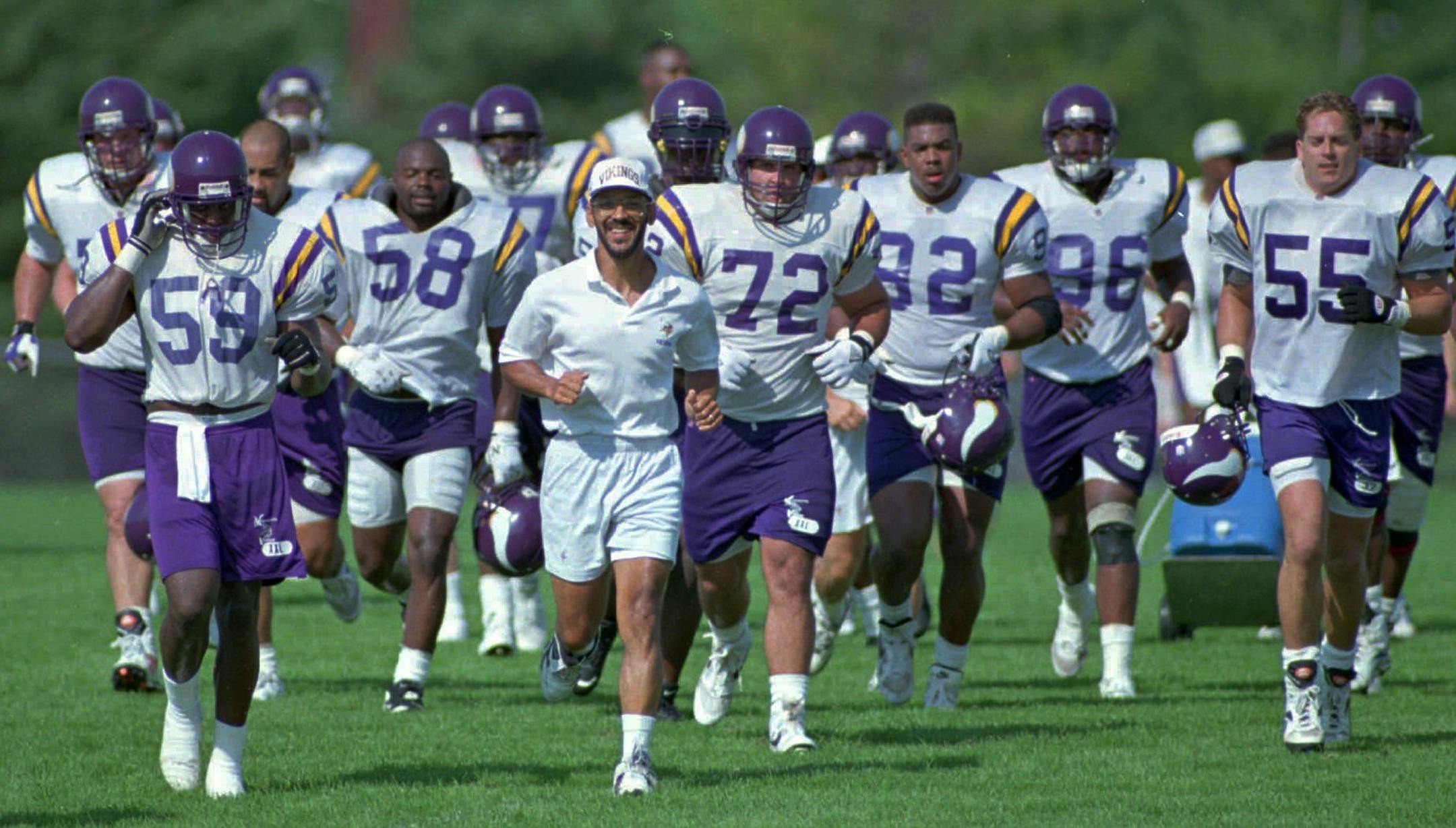 FILE: Vikings defensive coordinator Tony Dungy leads his defense across a practice field on the first day of camp in Mankato during the 1995 season.