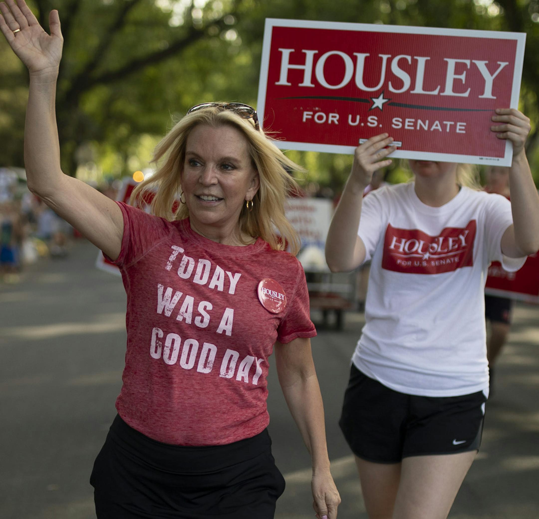 Karin Housley looked for hands to shake while campaigning during the Coon Rapids Fourth of July parade Monday evening. ] JEFF WHEELER &#xef; jeff.wheeler@startribune.com Republican state Sen. Karin Housley opposes abortion and will make Democrat Tina Smith's past work with Planned Parenthood an issue in their race for the senate seat once occupied by Al Franken. Karin Housley campaigned while walking in the Coon Rapids Fourth of July parade Monday evening, July 2, 2018.