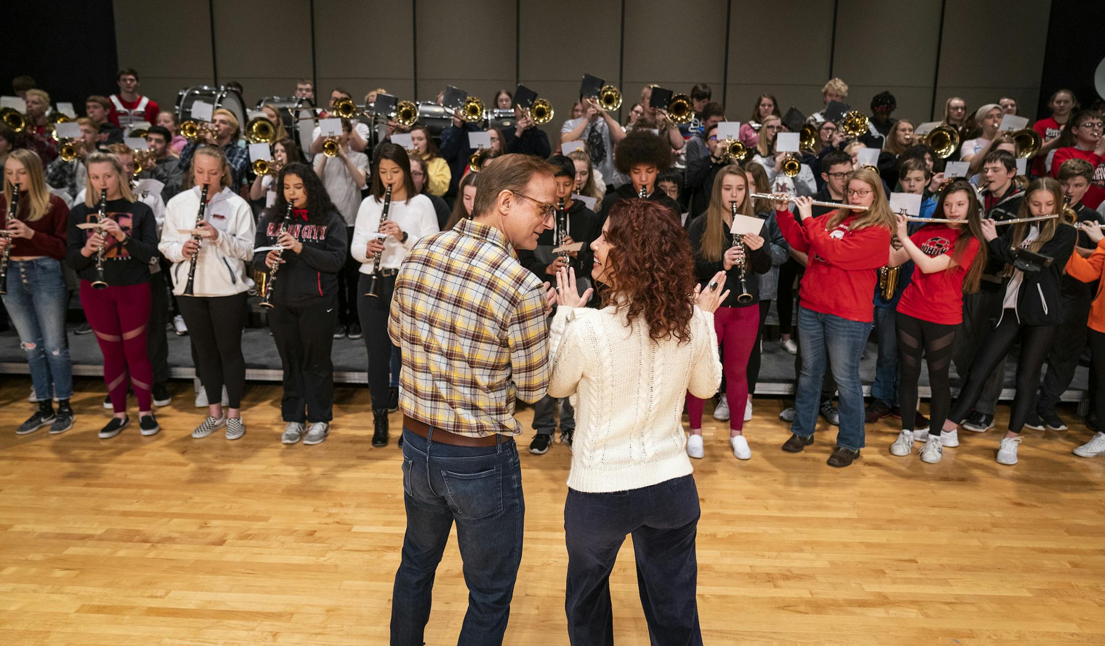 Michael Gruber and Ann Michels, who star as Harold Hill and Marian Paroo in Chanhassen Dinner Theatre's "The Music Man" conducted the Mason City High School Band in their rendition of "76 Trombones" at Mason City High School. ] LEILA NAVIDI &#x2022; leila.navidi@startribune.com BACKGROUND INFORMATION: The stars of Chanhassen Dinner Theatre's "Music Man" spend the day in Mason City, Iowa, the town that inspired the musical, on Monday, January 27, 2020.