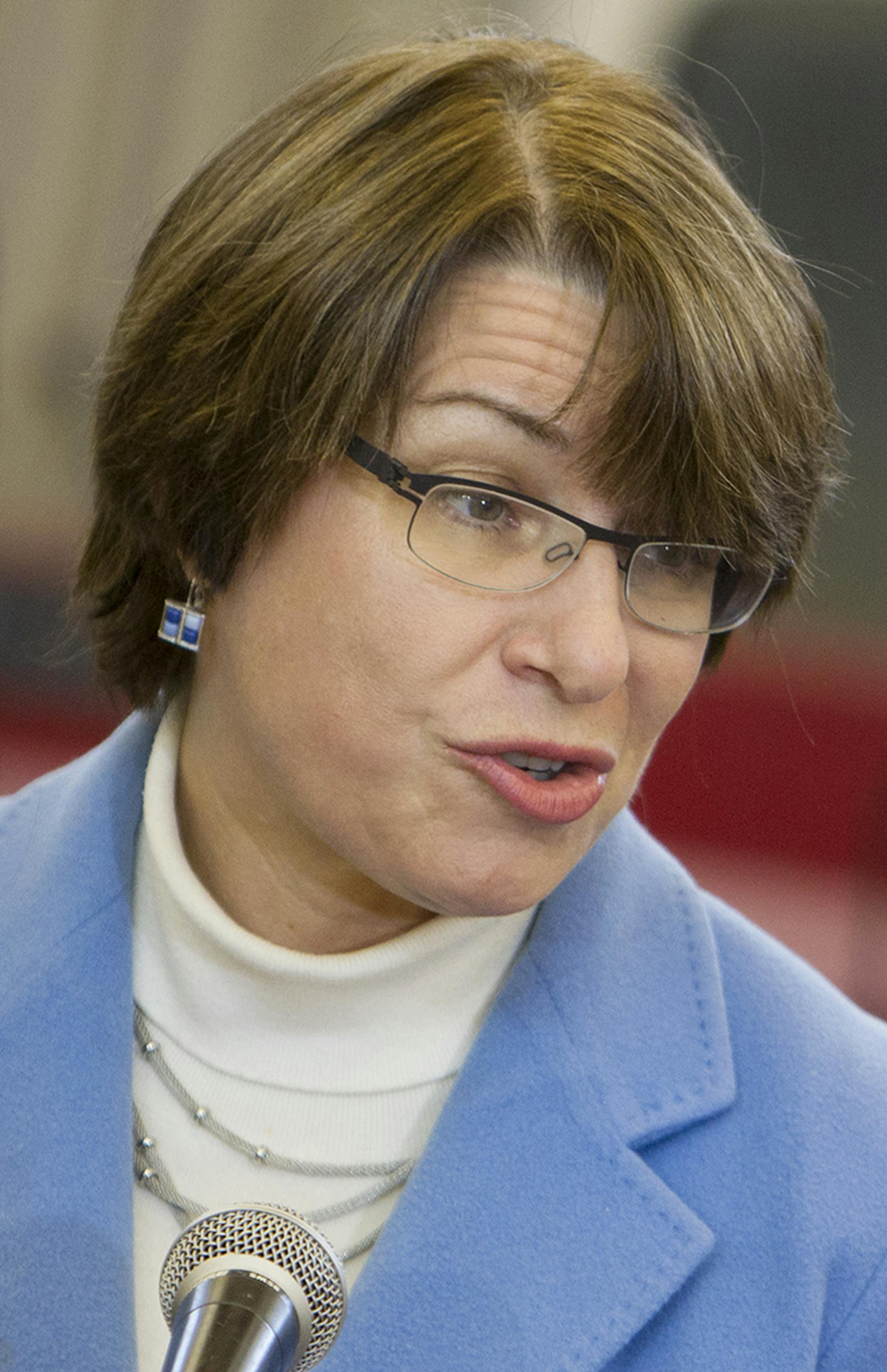 U.S. Senator Amy Klobuchar speaks to guests and media before awarding the Purple Heart to Vietnam veteran Fred Jenness after a 44-year delay at Golden Valley City Hall December 23, 2013. (Courtney Perry/Special to the Star Tribune) ORG XMIT: MIN1312231312593476