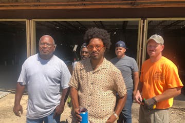 Chris Webley, center, is leading redevelopment project on the North Side. Helping are project manager Dwayne Etheridge of New Image Construction, left