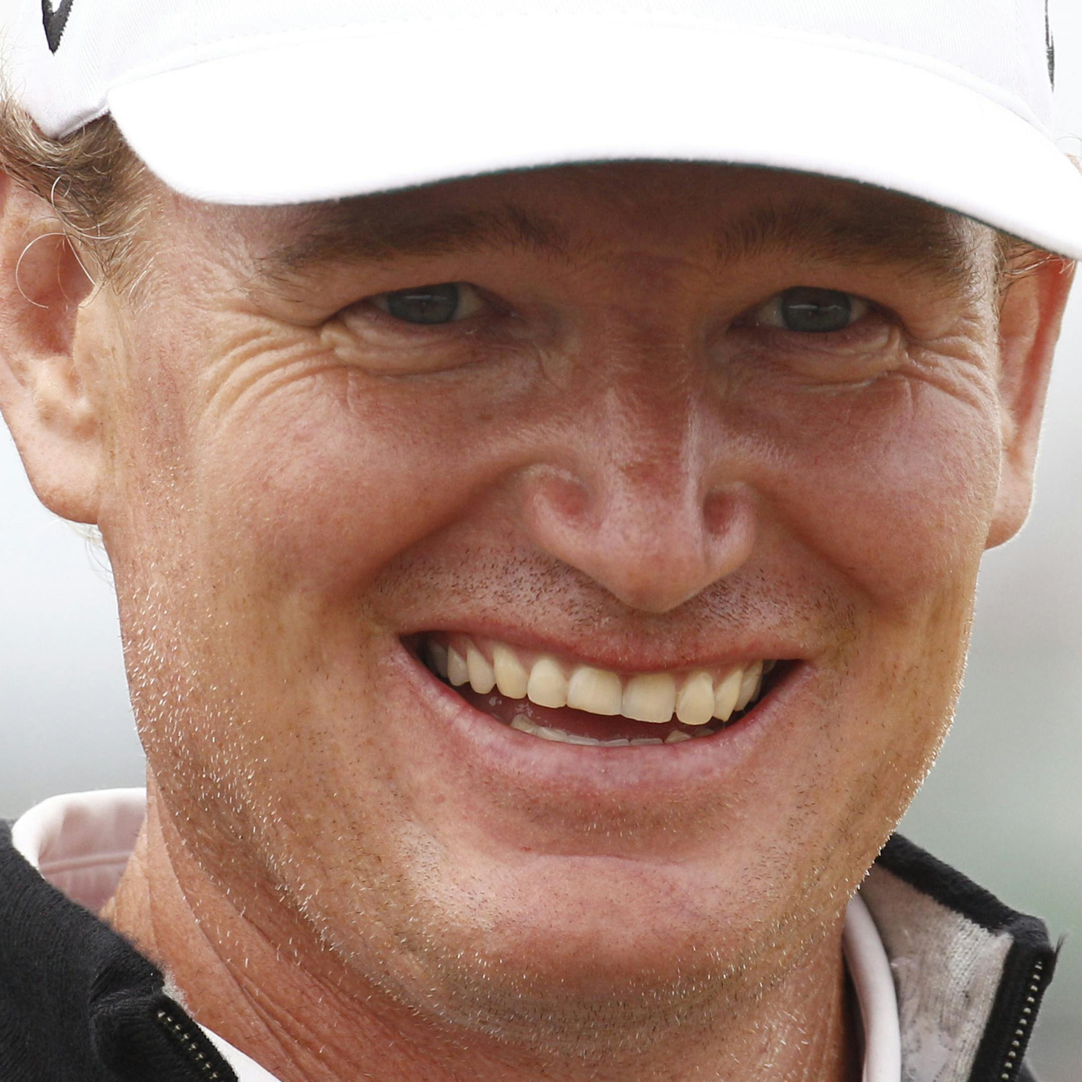 Ernie Els of South Africa smiles on the driving range ahead of the British Open Golf Championship at Muirfield, Scotland, Wednesday July 17, 2013. (AP Photo/Jon Super) ORG XMIT: MIN2013071719051797