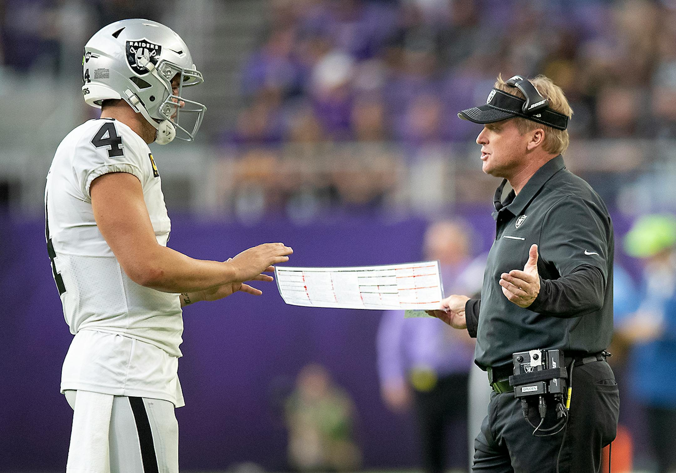 Raiders quarterback Derek Carr and Raiders Head Coach Jon Gruden near the side line in the fourth quarter.
