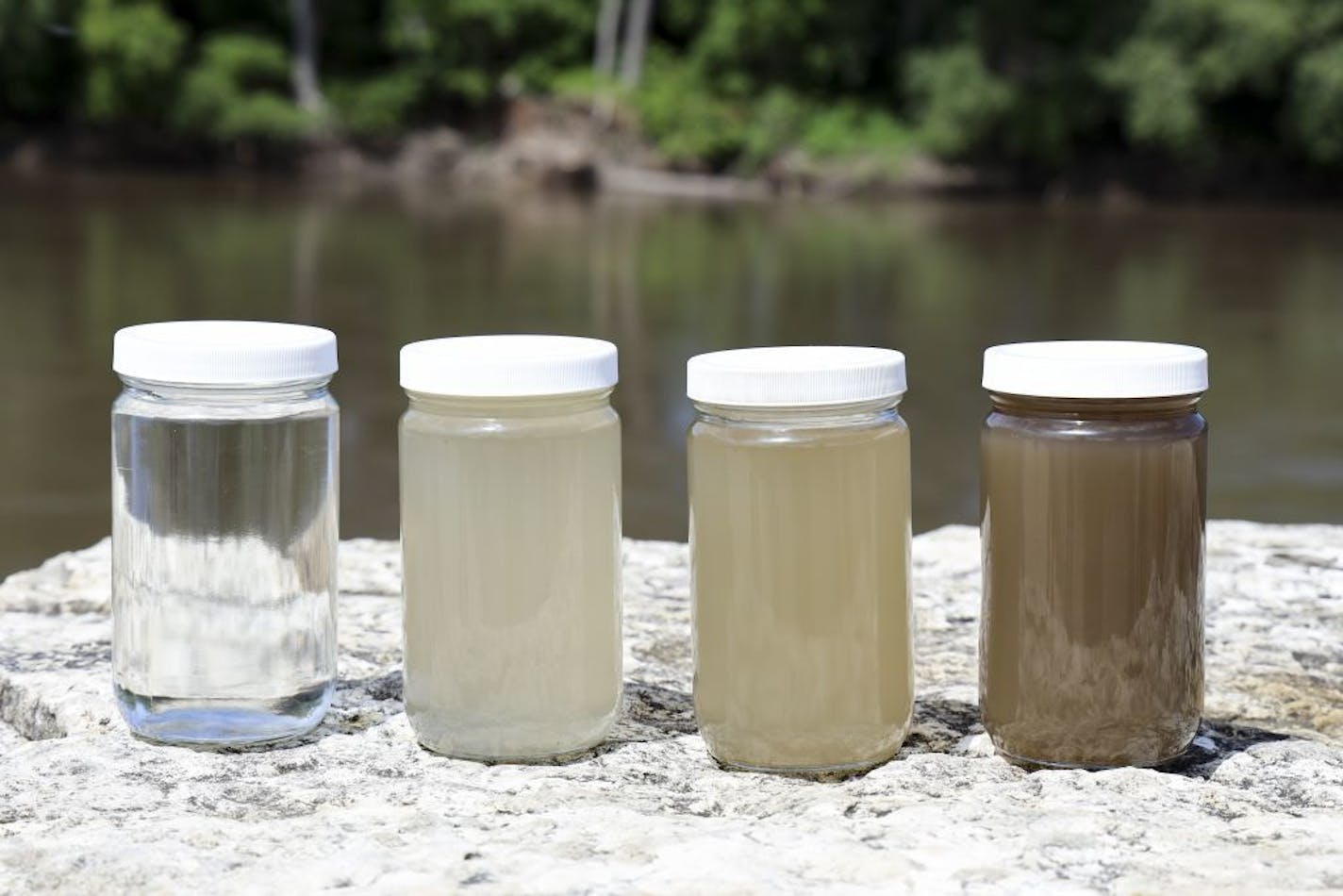 Using tap water as a basis for comparison, far left, Minnesota River basin samples showed a 50% reduction in sediment, second from left; average sediment over the past few years; and the worst conditions after a storm.