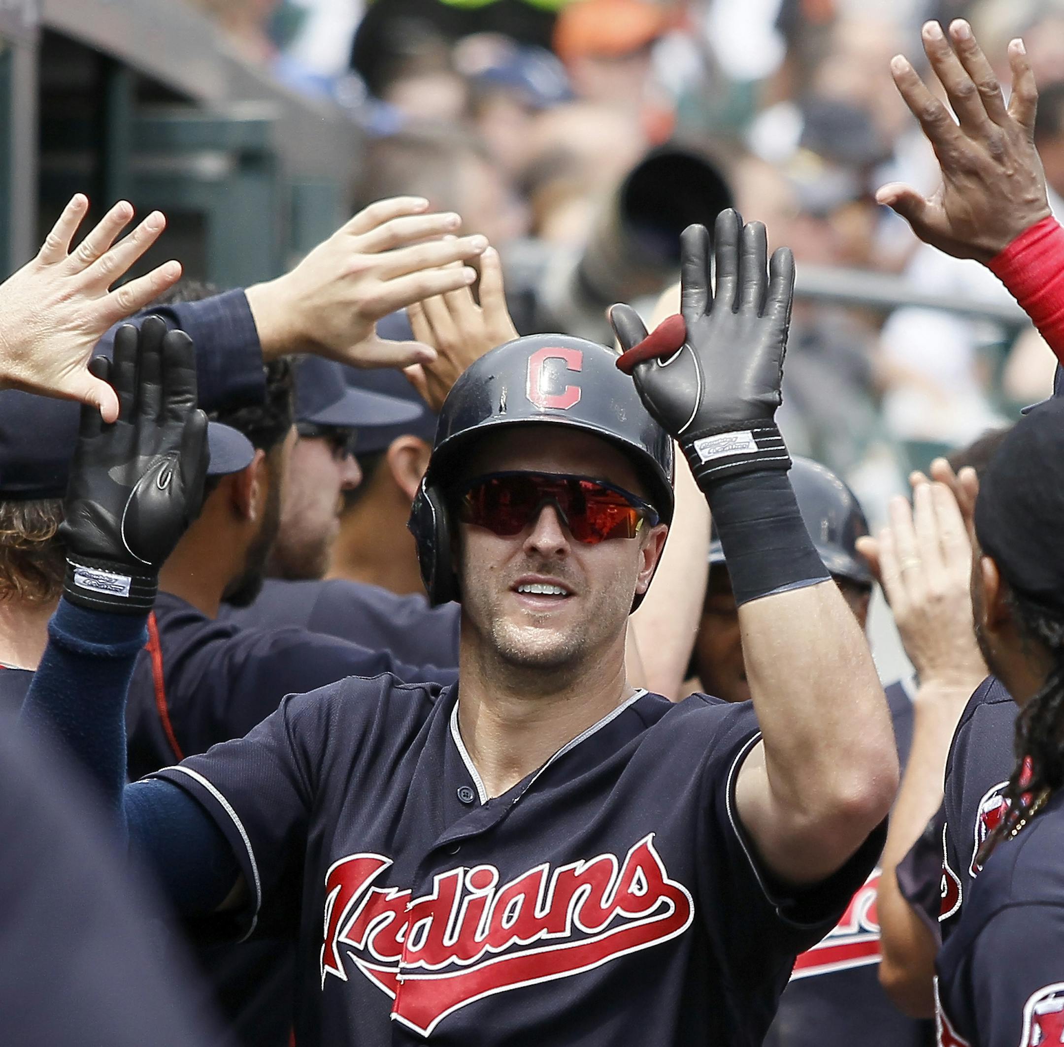 Cleveland Indians' Lonnie Chisenhall, left, celebrates with Michael Martinez (1) after hitting a two-run home run against the Detroit Tigers during the fifth inning of a baseball game Sunday, June 26, 2016, in Detroit. The Indians defeated the Tigers 9-3. (AP Photo/Duane Burleson)
