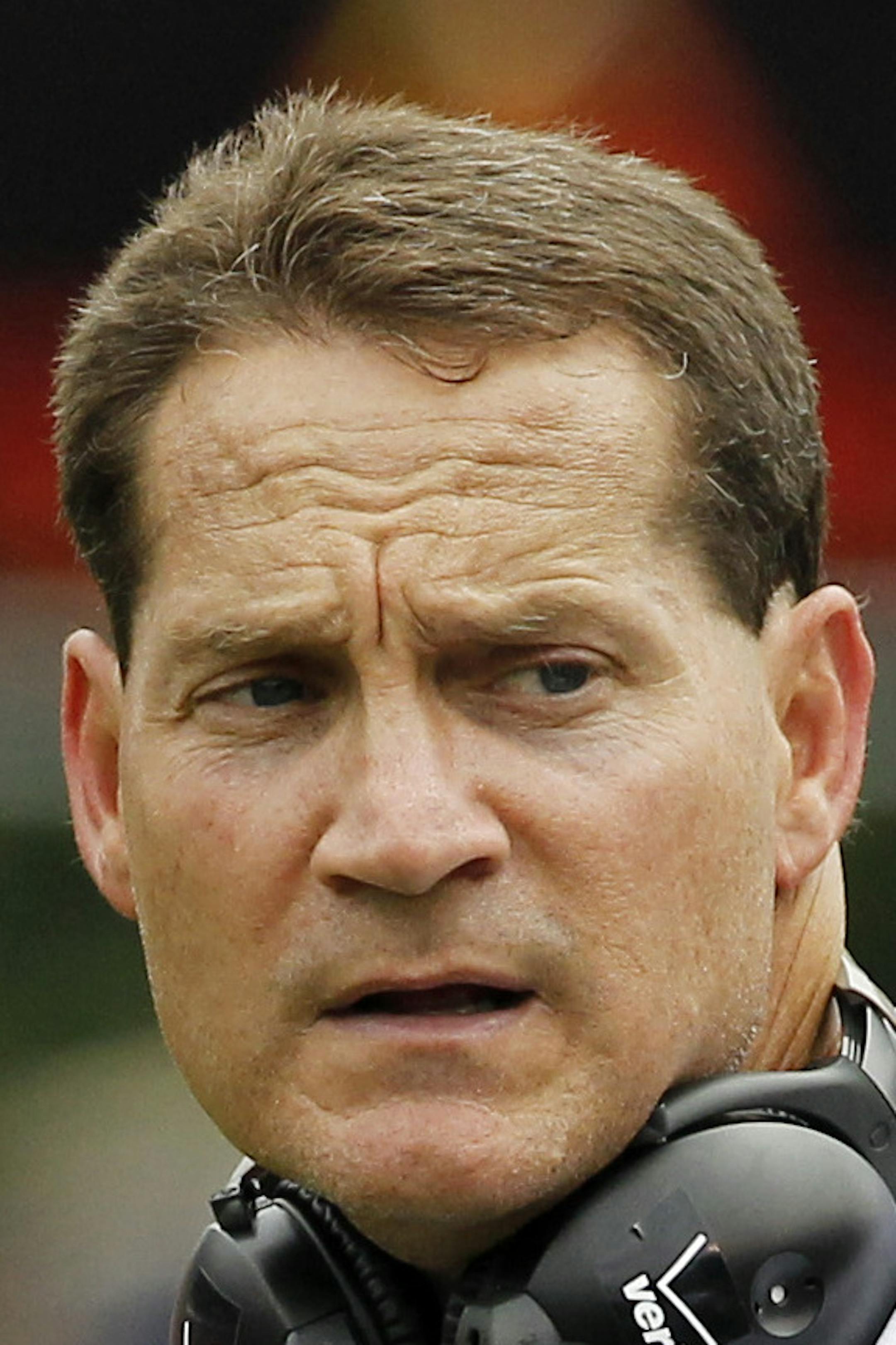 Auburn football coach Gene Chizik speaks to Auburn linebacker Daren Bates (25) as he leaves the field in the fourth quarter of their NCAA college football game against Mississippi State in Starkville, Miss., Saturday, Sept. 8, 2012. Mississippi State won 28-10. (AP Photo/Rogelio V. Solis) ORG XMIT: MSRS113