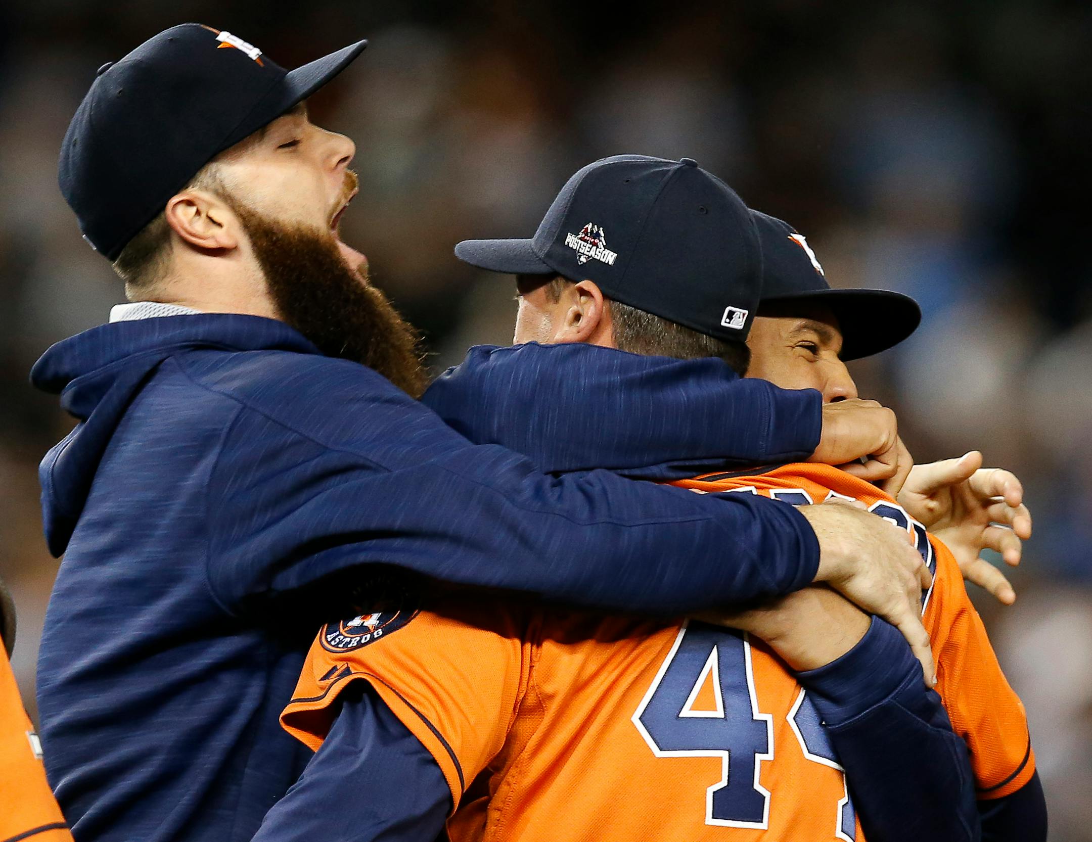 Astros starter Dallas Keuchel, left, embraced relief pitcher Luke Gregerson (44) and center fielder Carlos Gomez as they celebrated the Astros' 3-0 shutout of the New York Yankees in the American League wild-card game at Yankee Stadium on Tuesday.