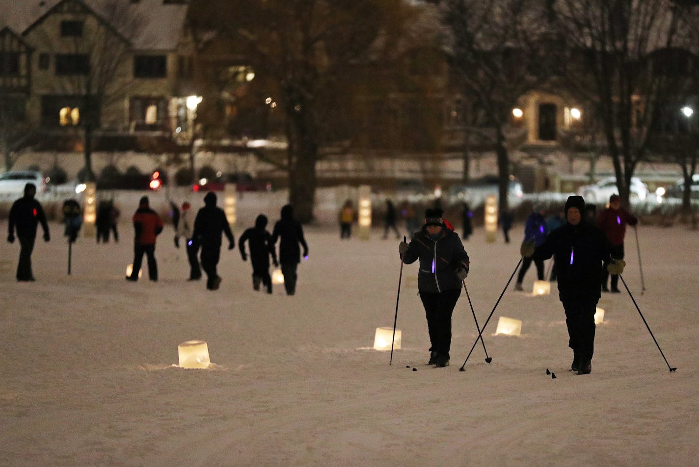 A pair of cross country skiers traversed the course during the annual Luminary Loppet Saturday night. ] ANTHONY SOUFFLE &#xef; anthony.souffle@startribune.com Attendees took part in the Luminary Loppet where people ski, walk or snowshoe across Lake of the Isles with beautiful luminary on the frozen lake to guide them Saturday, Feb. 3, 2018 on Lake of the Isles in Minneapolis.